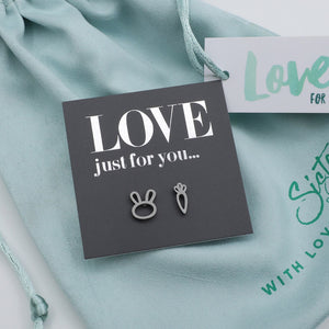 Silver earrings on a 'LOVE just for you' card with a teal background