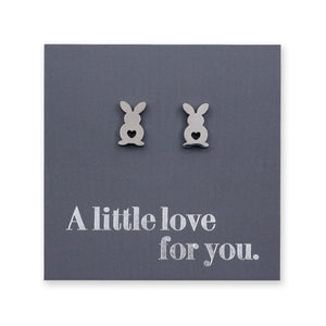 Bunny-shaped earrings on a card with 'A little love for you.' text