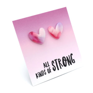 Heart-shaped earrings on a card with 'all kinds of strong' text