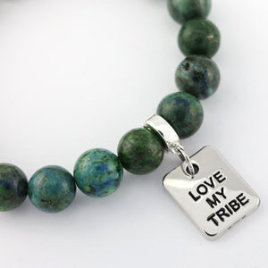 Green beaded necklace with a silver 'Love My Tribe' charm on a white background