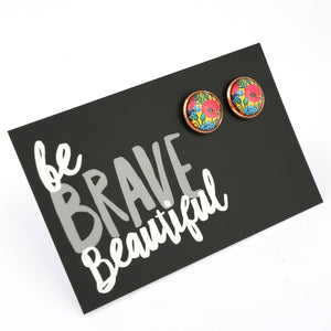 Colorful floral earrings on a black card with 'be brave beautiful' text