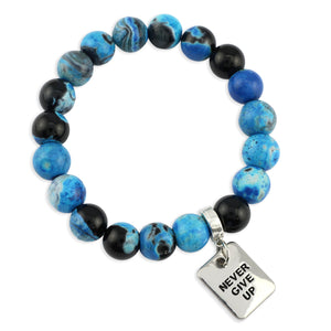Blue and black beaded bracelet with 'Never Give Up' charm on a white background