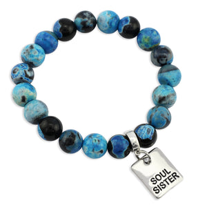 Beaded bracelet with blue and black beads and a 'Soul Sister' charm on a white background