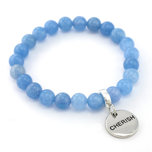 Blue beaded bracelet with a silver 'CHERISH' charm on a white background