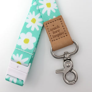 Lanyard with floral pattern and leather tag on a white background