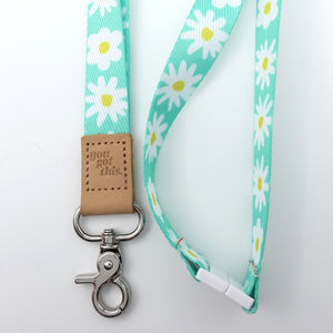 Lanyard with daisy pattern and 'you got this' leather tag on a white background
