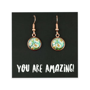 Pair of floral earrings on a black card with 'YOU ARE AMAZING!' text