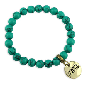 Turquoise beaded bracelet with a gold 'Friends Forever' charm on a white background