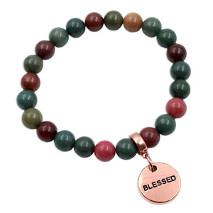 Bracelet with multicolored beads and a 'Blessed' charm on a white background