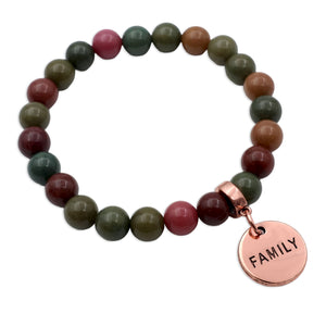 Beaded bracelet with a 'FAMILY' charm on a white background