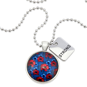 Necklace with a colorful pendant and a tag that says 'STRONG' on a white background