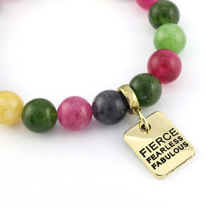 Colorful beaded bracelet with a gold tag reading 'Fierce Fearless Fabulous' on a white background