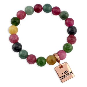 Multicolored beaded bracelet with a 'I AM ENOUGH' charm on a white background
