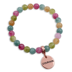 Multicolored beaded bracelet with a rose gold 'COURAGE' charm on a white background