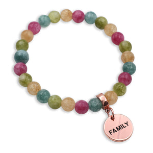 Multicolored beaded bracelet with a 'FAMILY' charm on a white background