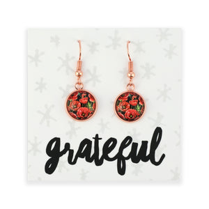 Rose gold floral earrings on a card with 'grateful' text