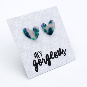 Heart-shaped earrings on a card with 'hey gorgeous' text