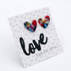 Heart-shaped earrings on a card with 'love just for you...' text