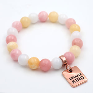 Beaded bracelet with 'Choose Kind' charm on a white background
