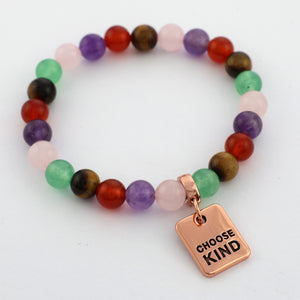 Multicolored beaded bracelet with a 'CHOOSE KIND' tag on a white background