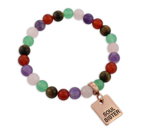 Multicolored beaded bracelet with 'Soul Sister' charm on a white background