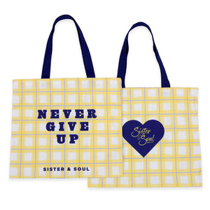 Two yellow tote bags with text and a heart design on a white background
