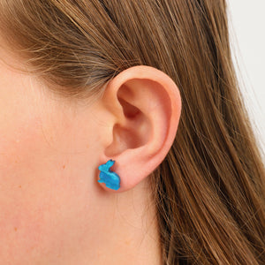 teal aqua coloured rabbit earring studs in girls ear