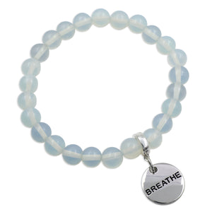 Blue beaded bracelet with a 'BREATHE' charm on a white background