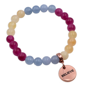 Multicolored beaded bracelet with a rose gold 'BELIEVE' charm on a white background