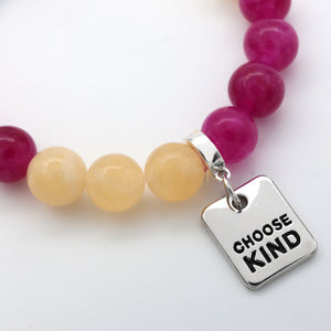 Colourful bead bracelet made form stone with silver clip and charm that says Choose Kind on white background.