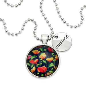 Necklace with floral pendant and 'COURAGE' tag on a white background