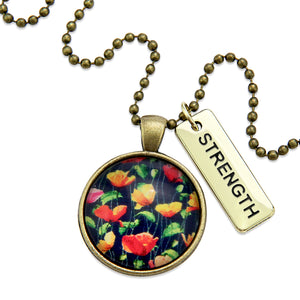 Necklace with floral pendant and 'STRENGTH' tag on a white background