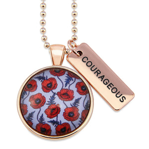 Necklace with floral pendant and 'COURAGEOUS' tag on a white background
