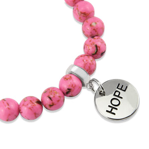 Pink beaded bracelet with a silver 'HOPE' charm on a white background