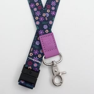 You Got This embossed on a navy floral lanyard with purple trim and a lobster clasp.