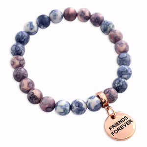 Beaded bracelet with 'Friends Forever' charm on a white background