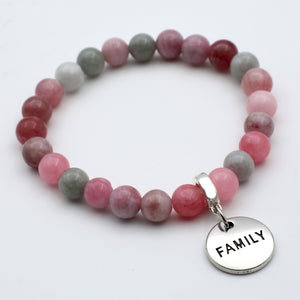 Beaded bracelet with a 'FAMILY' charm on a white background