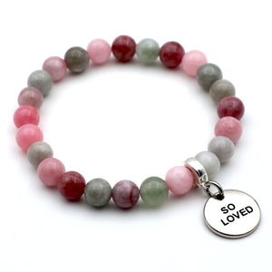 Multicolored beaded bracelet with a 'SO LOVED' charm on a white background