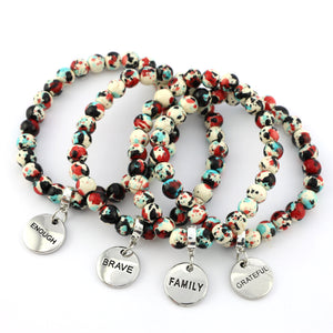 Stone Bracelet - Rebel Splash Speckled Howlite 8mm Beads - With Silver Word charm
