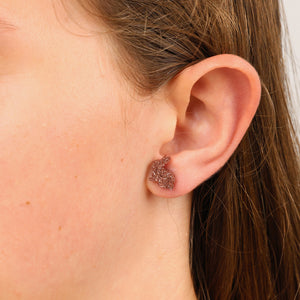 rose gold bunny glitter studs in ears