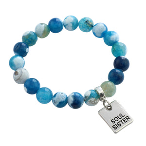 Blue beaded bracelet with 'Soul Sister' charm on a white background