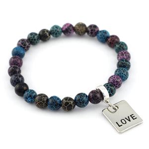Multicolored beaded bracelet with a 'LOVE' charm on a white background