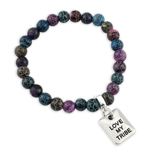 Multicolored beaded bracelet with 'Love My Tribe' charm on a white background