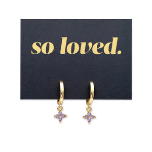 Gold hoop earrings with purple stones on a 'so loved' card