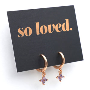 Rose gold earrings with purple stones on a 'so loved' card