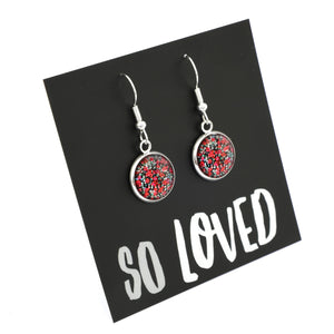 Dangle earrings with red and silver design on a 'SO LOVED' card