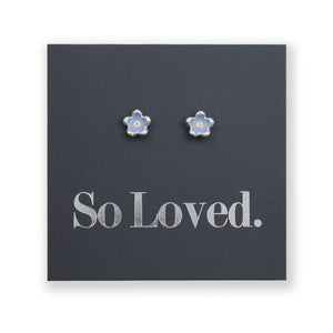 Blue flower earrings with blue and orange enamel detail on a grey card with silver 'So Loved' writing.