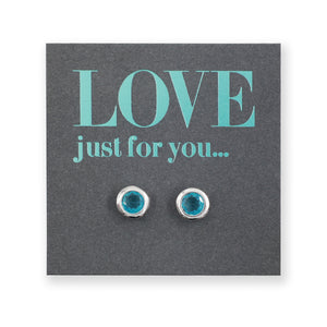 teal gem circle silver studs on grey card with teal writing that says "love just for you" on a white background