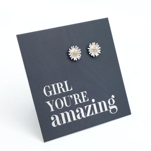 silver daisy studs on a grey card that says "girl You're Amazing" on a white background