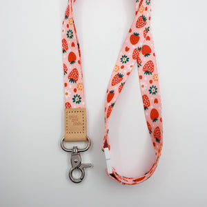 You Got This embossed on a pink strawberry and flower lanyard with tan trim and a lobster clasp.